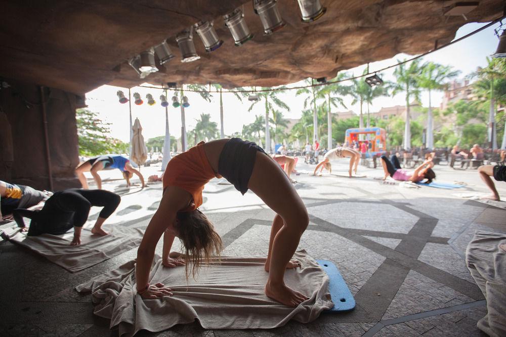 Lopesan Baobab Resort Meloneras Esterno foto A woman practicing yoga at the 2011 Miami Book Fair International